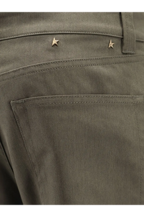 Golden goose men’s leniin olive green cotton blend denim jeans with two small gold star metal accents on the waistband