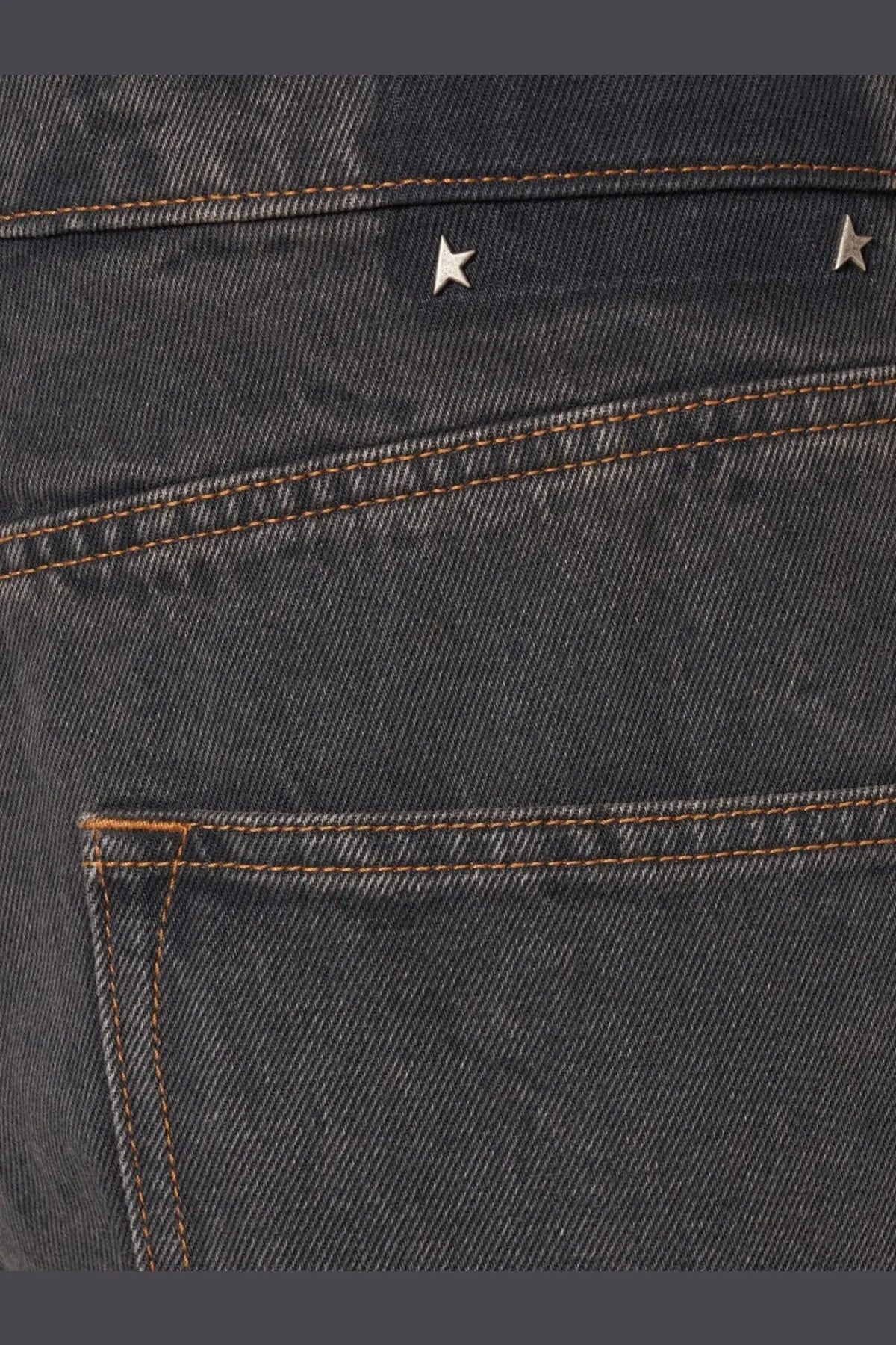 Back side of golden goose men’s ms pant cory loose skate jeans black with dark-wash denim and silver star studs above pocket