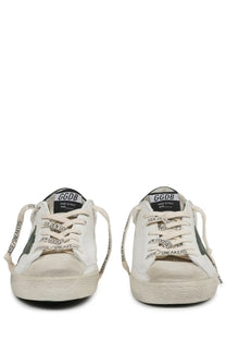Golden Goose men’s sneaker Superstar white distressed canvas low-top with black and gold branding details