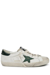 Golden Goose men’s sneaker superstar white leather with dark green star emblem and distressed details