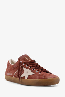Golden Goose men’s super star suede sneakers in rust with white star emblem and gum rubber sole