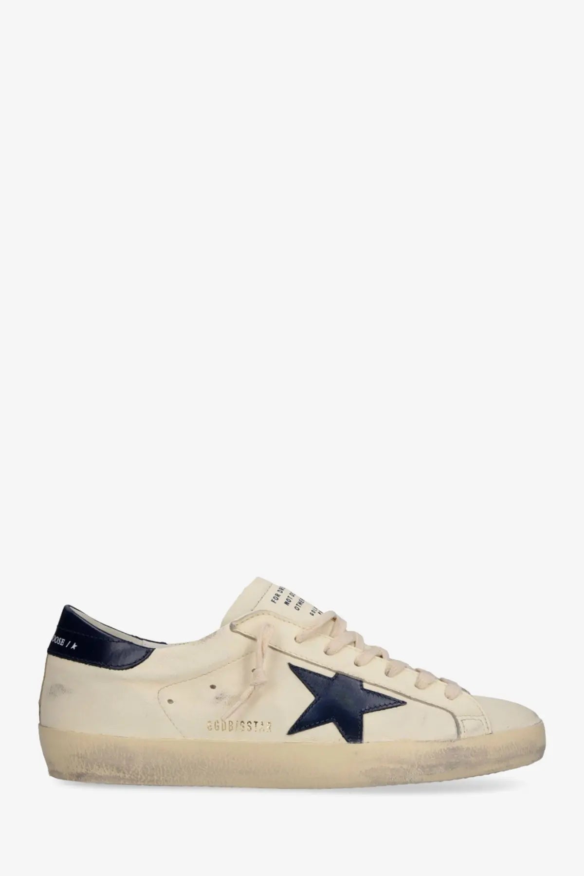 Cream-colored suede golden goose men’s super star sneaker with navy blue star patch and heel tab in leather