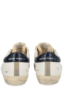 Golden goose men’s superstar sneaker white with white and navy blue distressed leather and vintage look