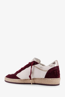 Golden goose women’s ballstar leather sneaker in maroon and white suede with metallic silver heel tab and espadrille sole