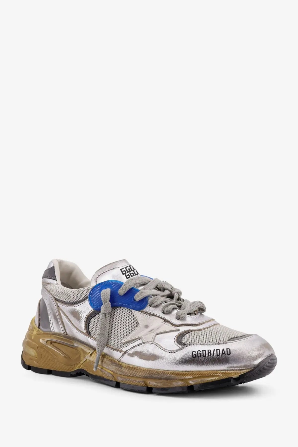 Silver metallic Golden Goose women’s running dad sneaker with blue lace tab, gold translucent sole, and ggdb dad branding