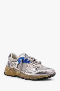 Silver metallic Golden Goose women’s running dad sneaker with blue lace tab, gold translucent sole, and ggdb dad branding