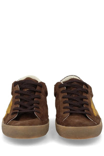 Golden goose women’s super star sneaker brown suede with gold tone accents and black laces front view