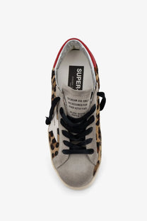 Golden Goose women’s Super Star sneaker in leopard-print suede with red heel tab and black laces white color