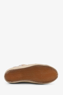 Golden Goose women’s Super Star beige suede slip-on sneaker with brown rubber sole and zigzag tread pattern