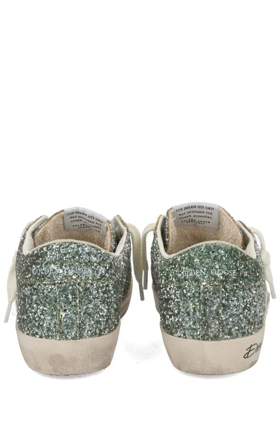 Golden Goose women’s Superstar sneaker in glittery green and silver with white laces and distressed beige sole