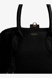 Black leather golden goose vita crossbody bag with gold-tone hardware and golden goose logo plaque