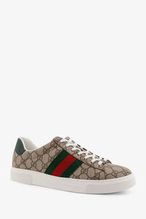 Beige gucci men’s ace supreme low top sneaker with brown gg logo fabric and green red striped side panel