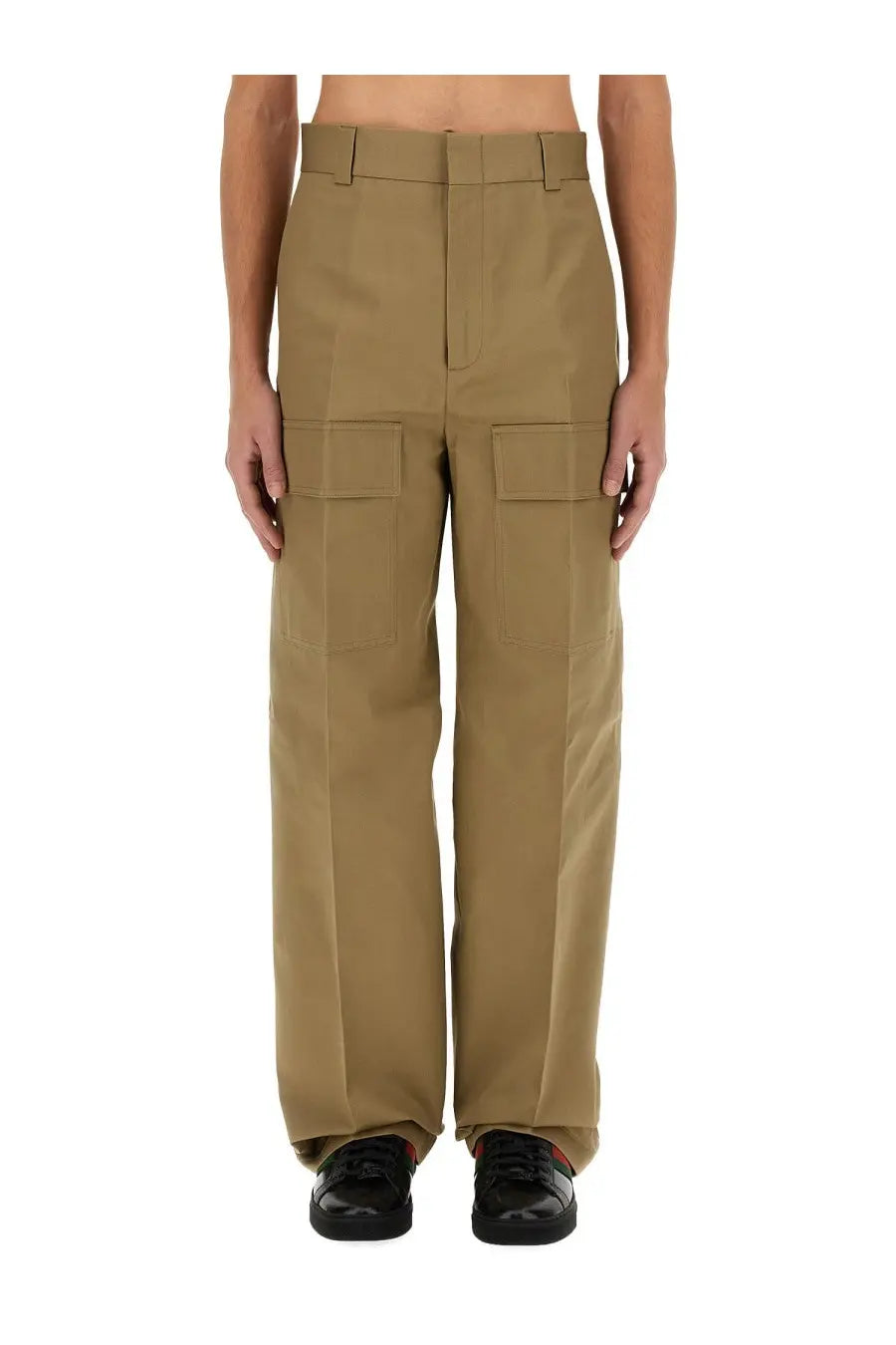 Gucci men’s beige khaki cargo pants with two flap pockets on each leg and a belt looped at the waist