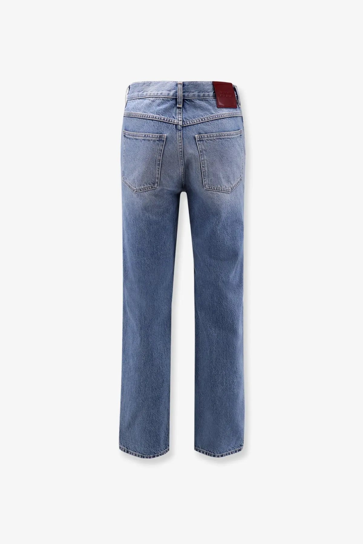 Light-wash Gucci men’s certified cotton slim fit jeans with straight-leg cut and red leather brand patch at waistband back view