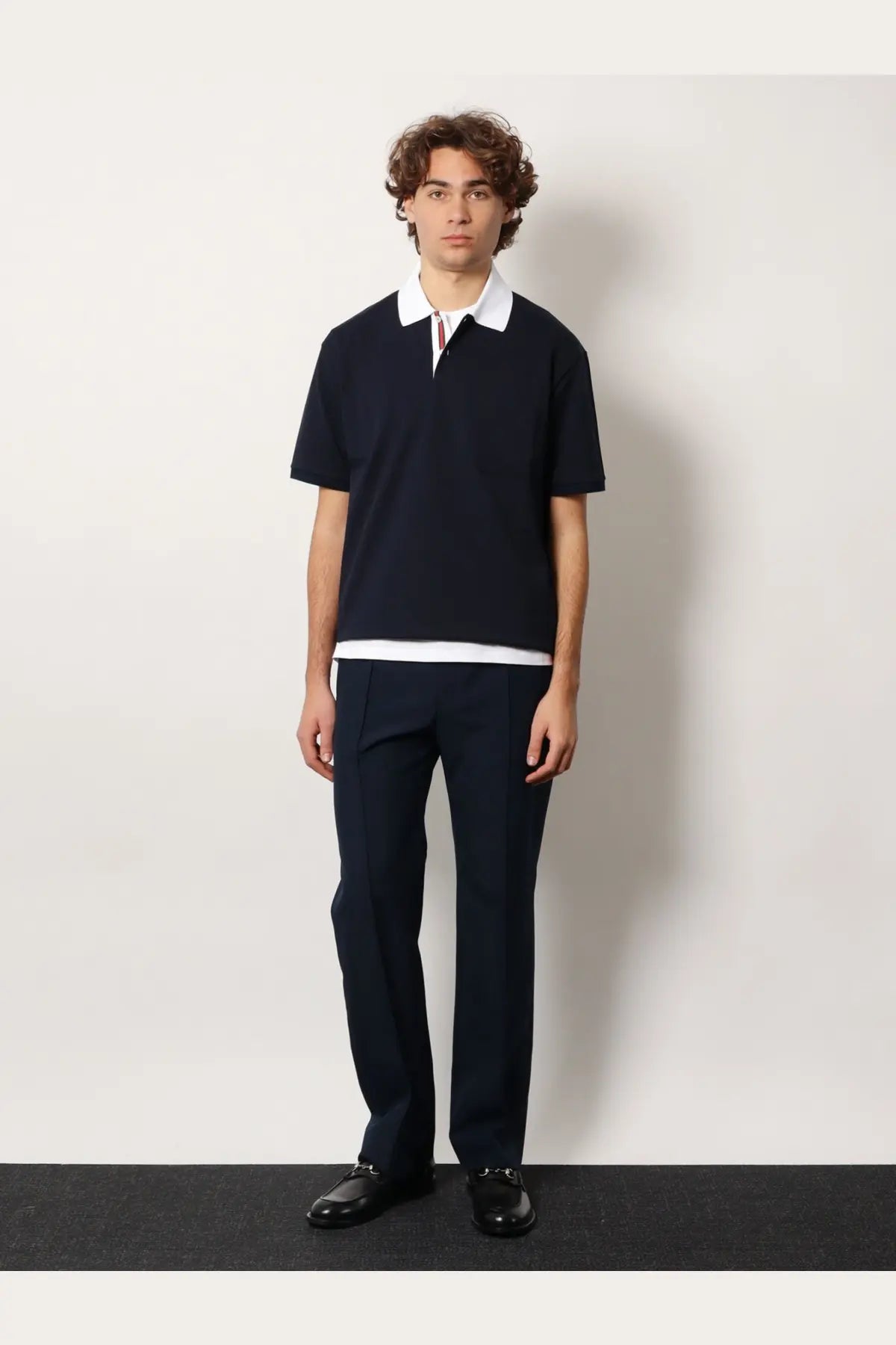 Gucci men’s navy blue cotton piquet polo shirt with white collar and hem featuring striped placket detail