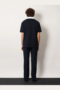 Gucci men’s black cotton piquet polo shirt with short sleeves and a crisp white collar