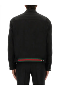 Gucci men’s black cotton twill jacket with distinctive red and green striped band at the hem back view