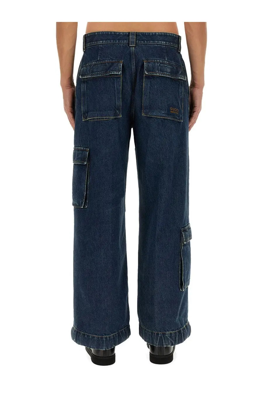 Dark blue denim cargo pants by Gucci men featuring multiple pockets and a relaxed wide leg cut