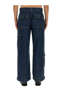 Dark blue denim cargo pants by Gucci men featuring multiple pockets and a relaxed wide leg cut