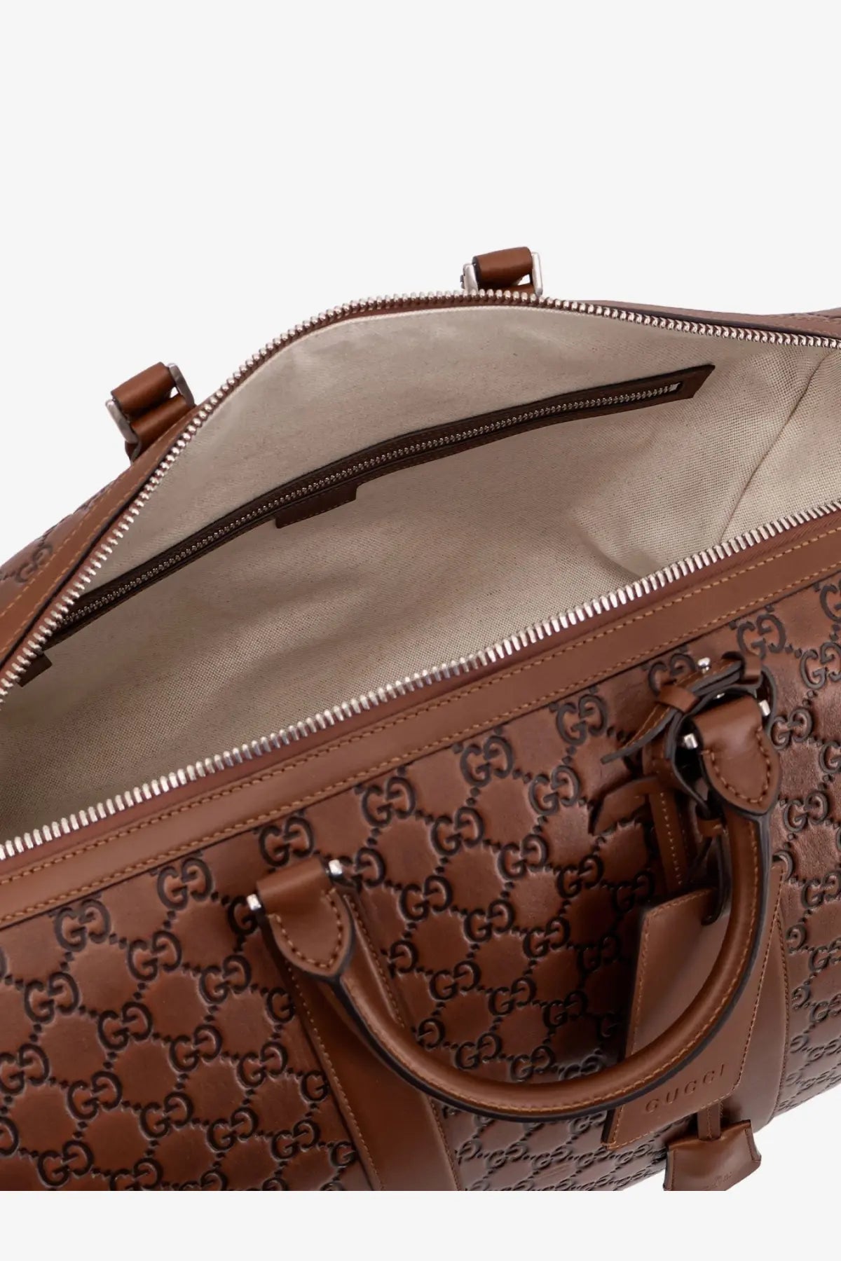 Brown Gucci GG Supreme leather duffel bag with top handles and zipper closure for men by Gucci