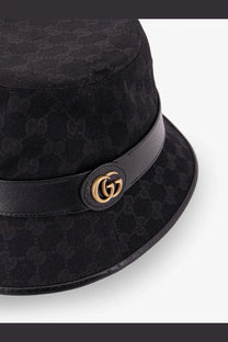 Black gucci men’s cloche bucket hat with repeating monogram fabric and gold-tone interlocking gg logo on leather band