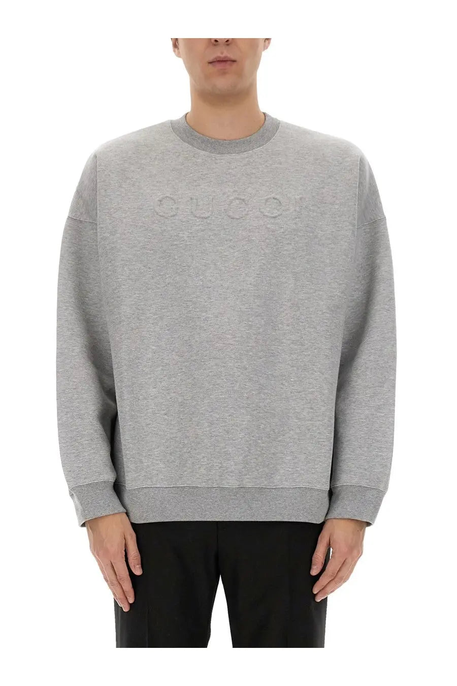 Gucci men’s grey jersey sweatshirt with gray heathered fabric and embossed logo across the chest