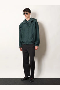 Gucci men’s reversible ripstop cotton jacket in dark green with hood subtle textured fabric and front zipper closure