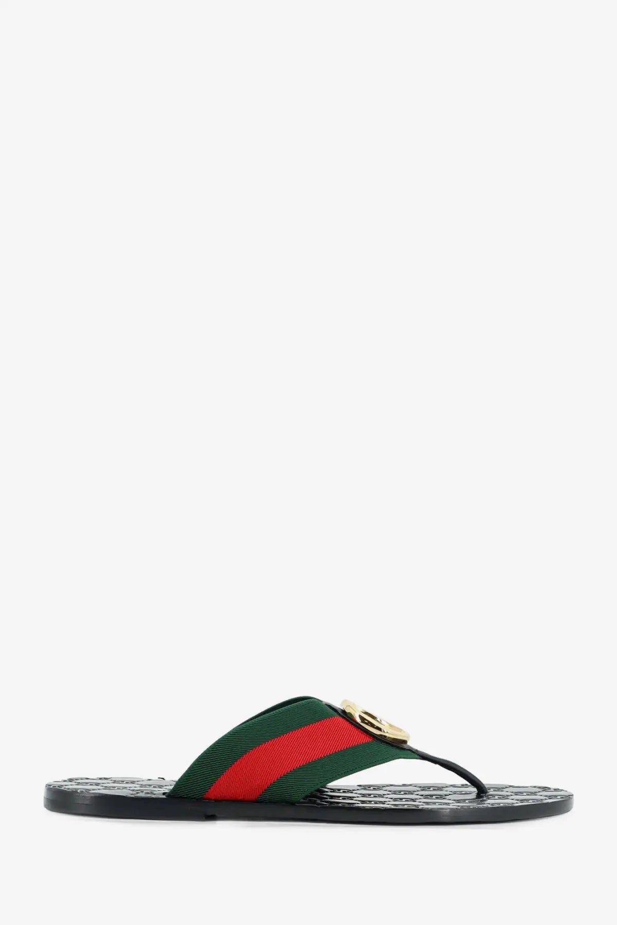 Black Gucci men’s Riviera leather sandals with green and red striped webbing strap and gold-tone GG logo buckle