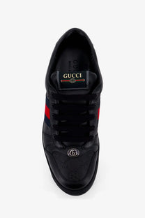 Gucci men’s Screener leather sneakers black with red and green stripes and metallic GG logo on the toe