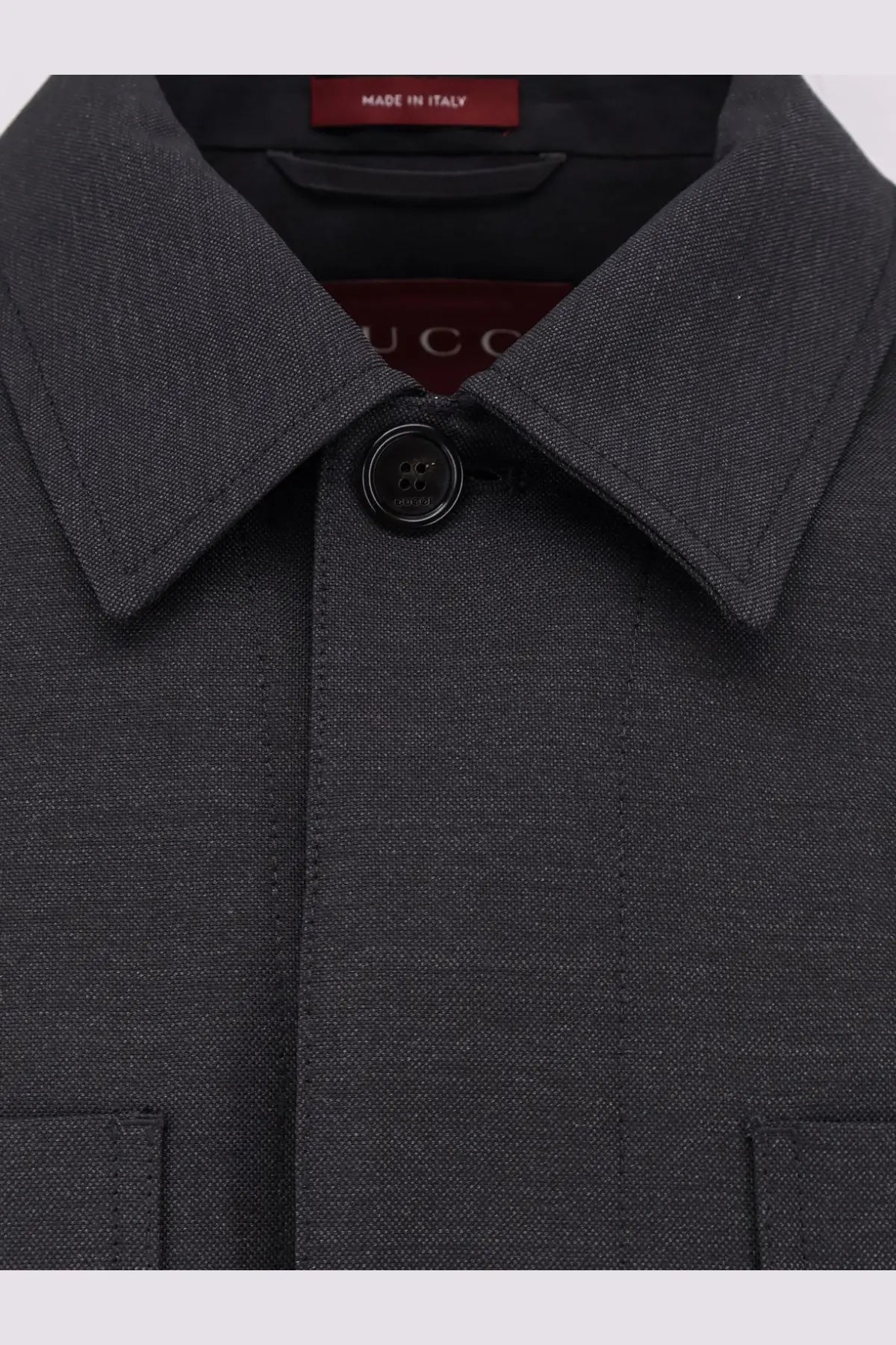 Gucci men’s wool shirt jacket grey in dark gray textured wool with black button and Gucci branding tag