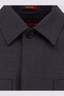Dark gray textured wool men’s shirt jacket with black buttons and Gucci branding tag in grey color