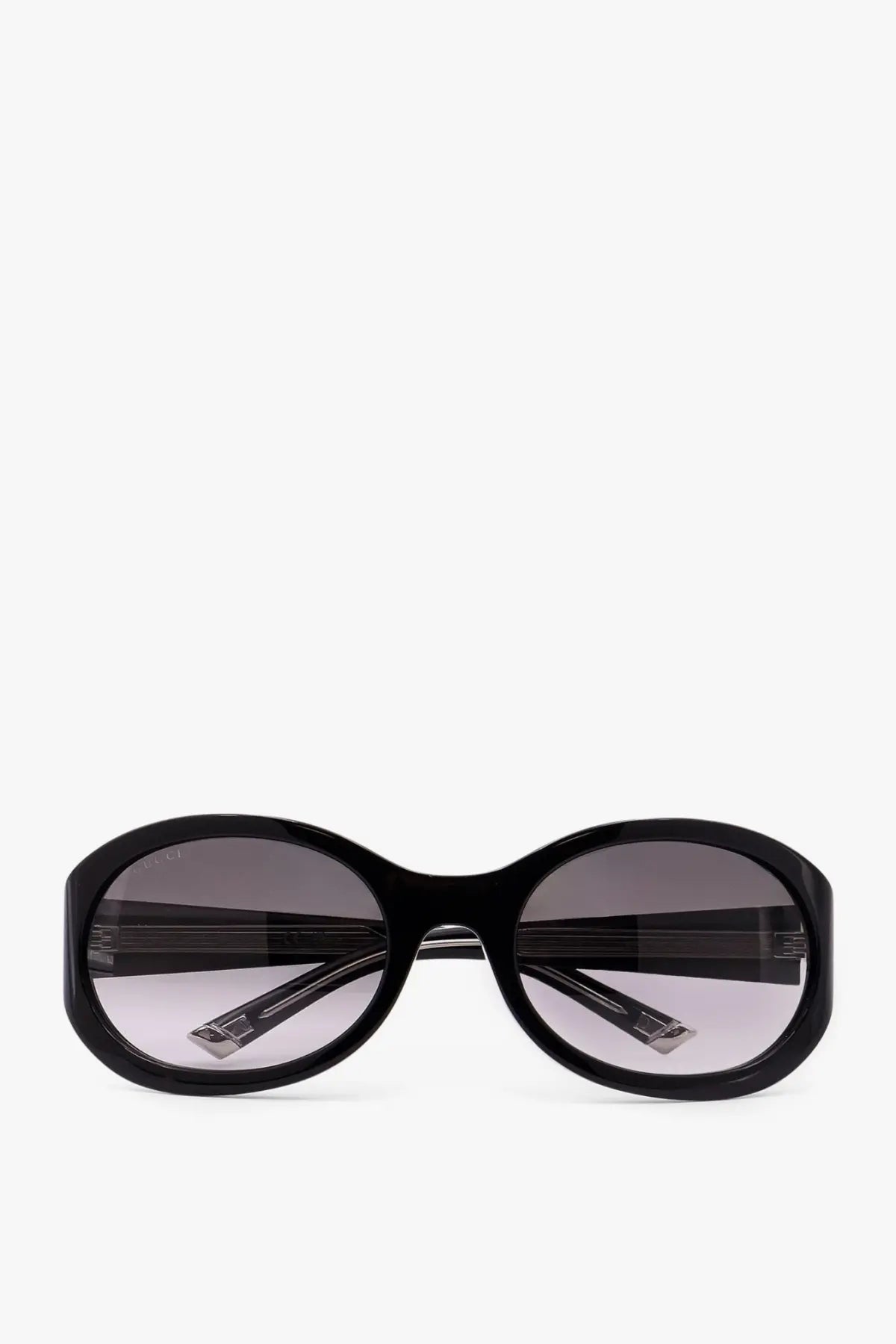 Gucci women’s black acetate sunglasses with black oval frame and gradient gray lenses in a sleek modern design