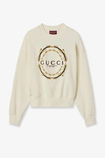 Gucci women’s cream-colored brushed cotton sweatshirt with bold gold and black circular chain logo on front