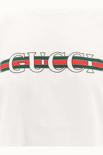 White Gucci women’s cotton t shirt featuring the iconic interlocking Gucci logo with red and green striped ribbon design