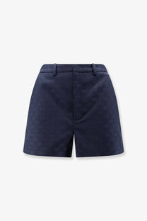 Navy blue Gucci women’s GG cotton blend shorts with a subtle pattern and tailored high-waisted design