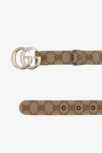 Tan Gucci women’s GG Marmont coated canvas belt beige with interlocking GG logo buckle close-up view