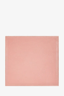 A soft pink Gucci women’s silk and wool shawl featuring a subtle textured pattern in a square pocket square design