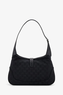 Black gucci women’s jackie gg fabric shoulder bag with subtle monogram pattern and leather trim