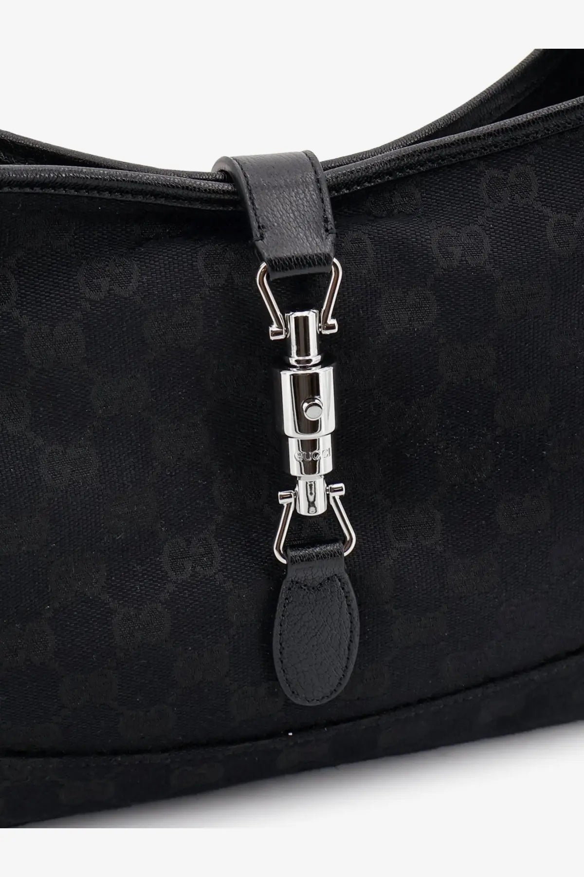 Black Gucci women’s Jackie GG fabric shoulder bag with black leather accents and silver-tone metal clasp