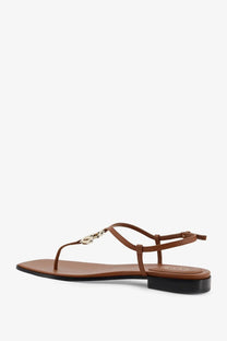 Gucci womens lifford yellow leather sandal with brown t-strap, metallic chain link, and low black heel
