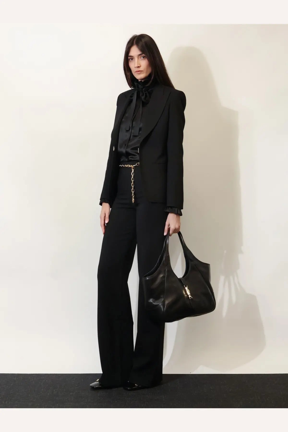 Black leather Gucci womens Mercato hobo shoulder bag with gold-tone hardware and soft slouchy design
