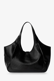 Gucci women’s mercato black leather tote bag with glossy finish and structured handles for shoulder wear