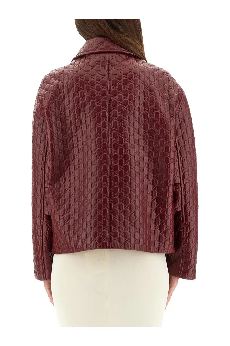 Back of gucci women’s oversized red leather jacket with embossed interlocking gg logo pattern