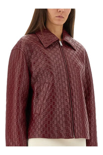Gucci women’s oversized burgundy quilted leather jacket with an all-over interlocking gg logo pattern facing back