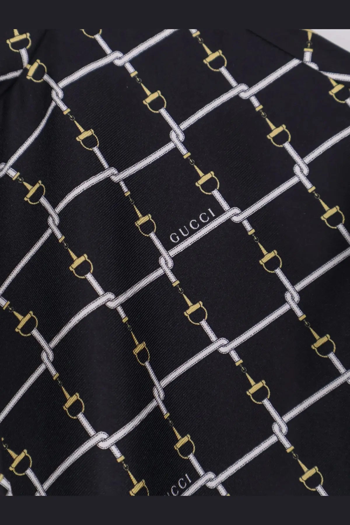 Black gucci women’s short silk twill dress with black gucci silk scarf featuring white and gold horsebit chains pattern