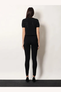 Gucci women’s black short wool dress featuring short sleeves and sparkling embellishments