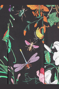 Black gucci silk midi skirt featuring a vibrant insect and flower print in pink green orange and white colors