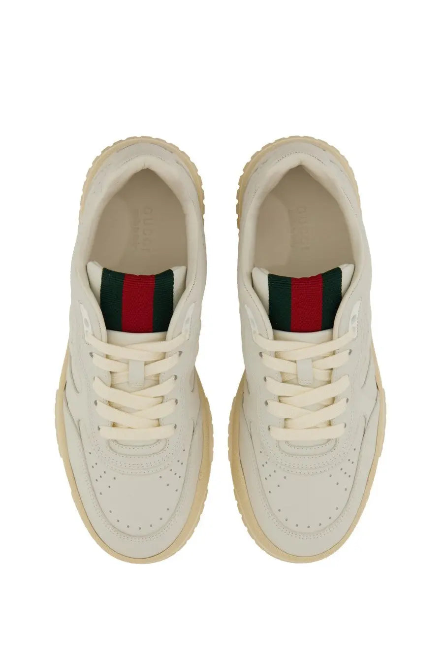 Cream-colored Gucci women’s sneaker re web white with classic leather upper red and green striped heel and chunky sole back view