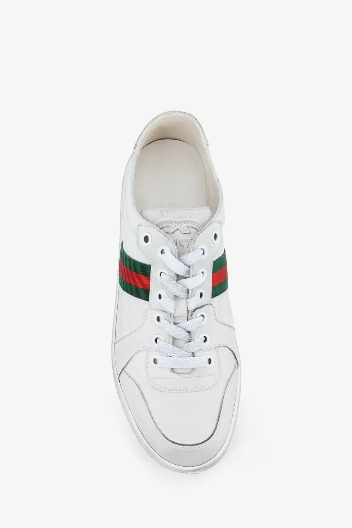 White leather gucci women’s stretch sneakers with classic green and red striped accents along the side