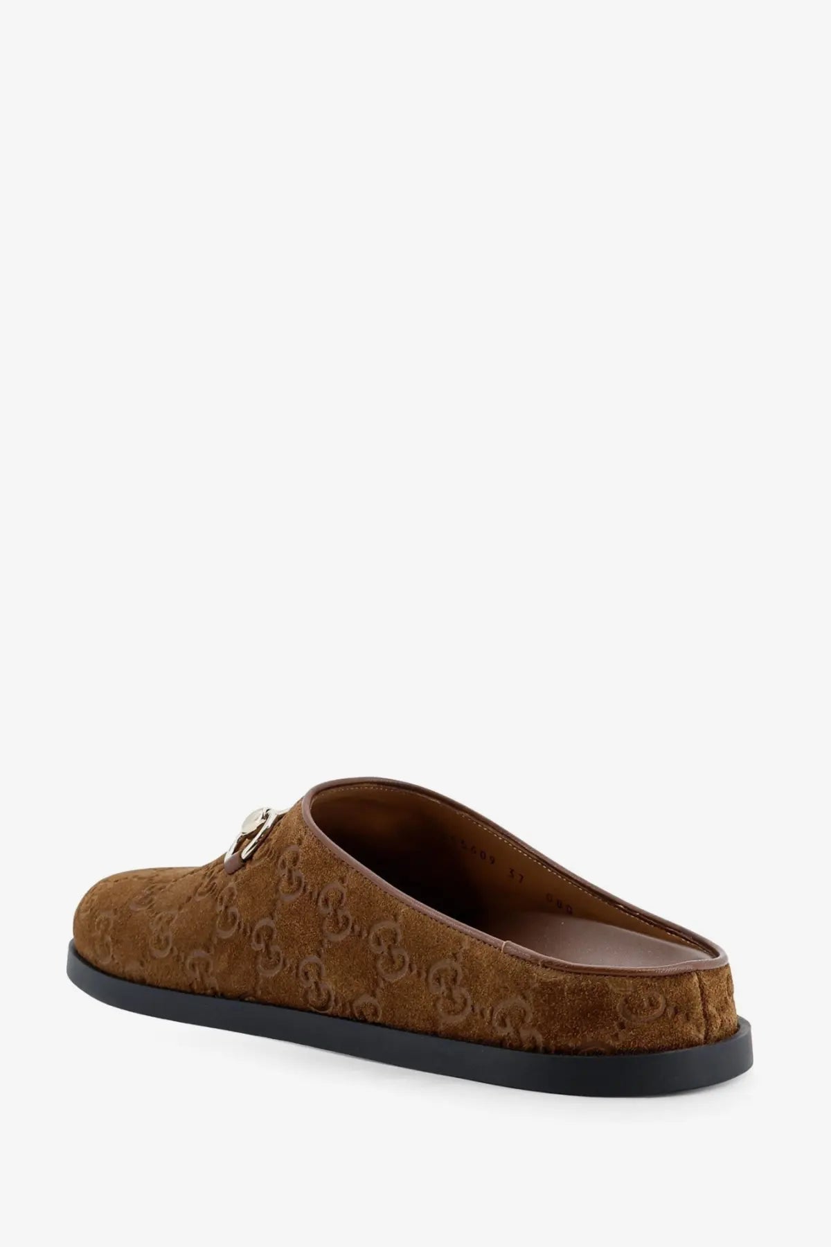 Gucci women’s brown suede mule sandals with gg monogram pattern and silver metal accent at the vamp